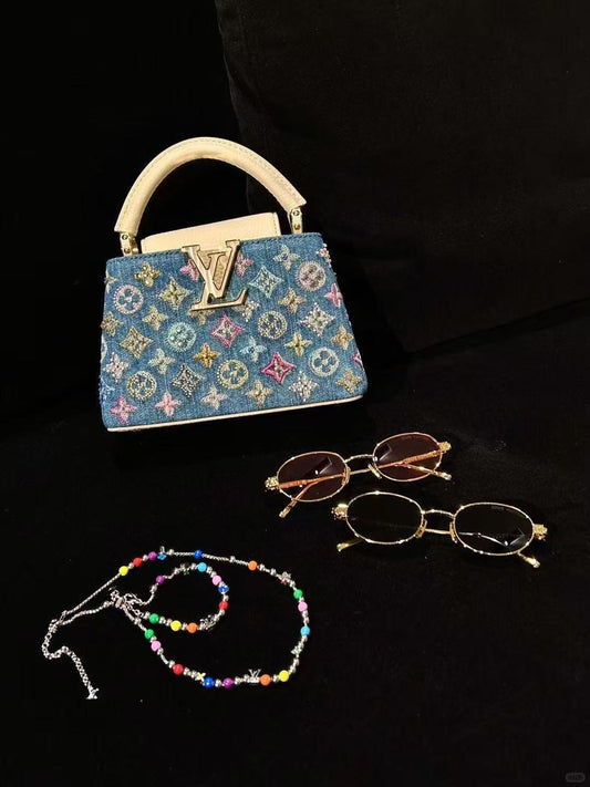 Mini borsa Capucines di lusso decorata in denim