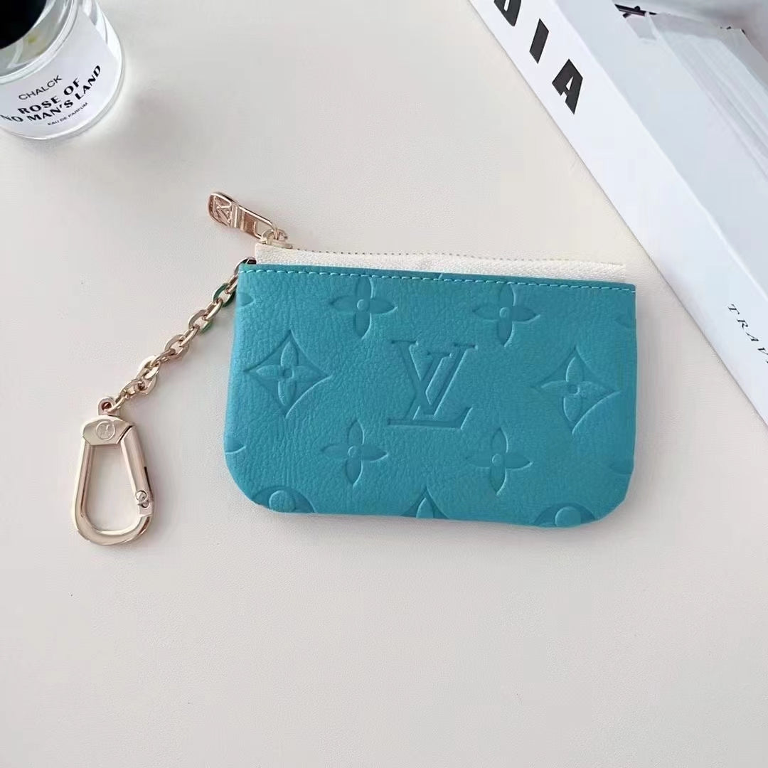 Collezione di portamonete in rilievo di ispirazione colorata con clip a catena