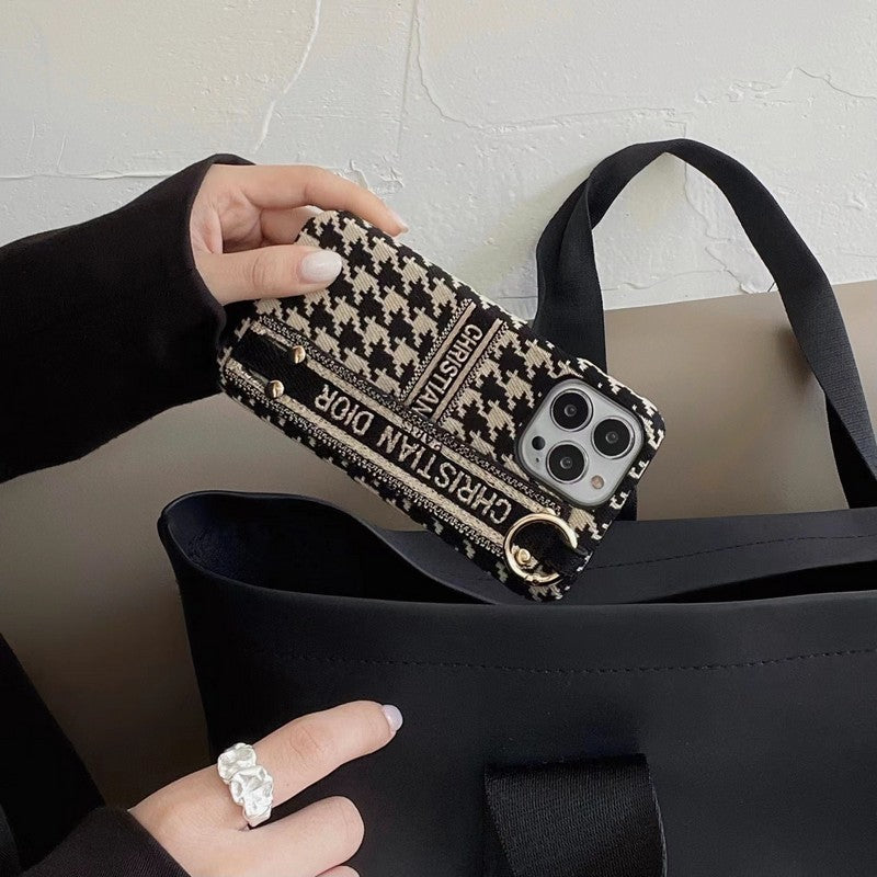 Custodia per iPhone con cinturino alla moda con motivo pied de poule