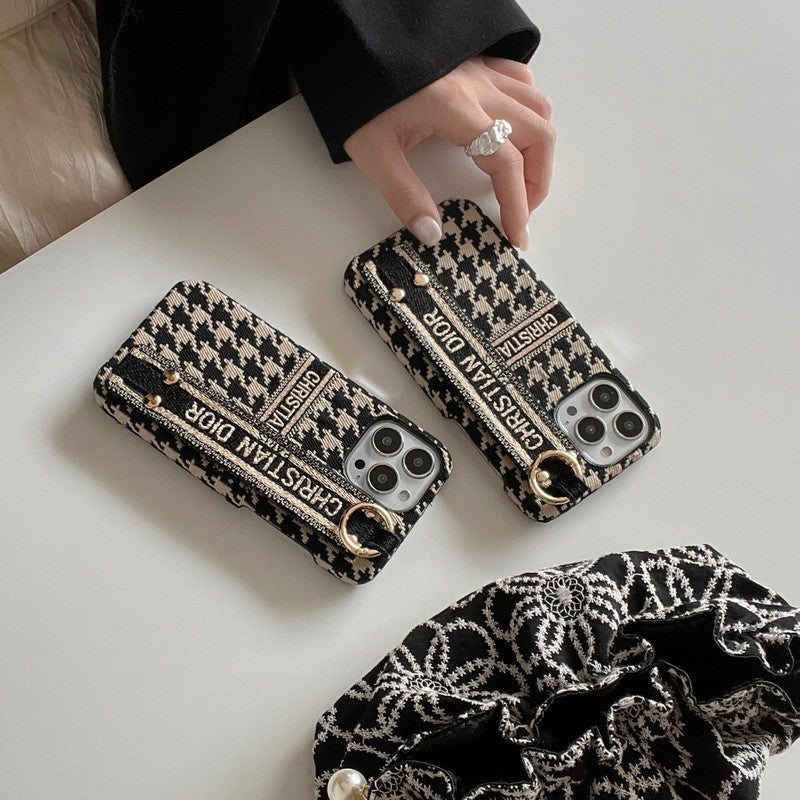 Custodia per iPhone con cinturino alla moda con motivo pied de poule